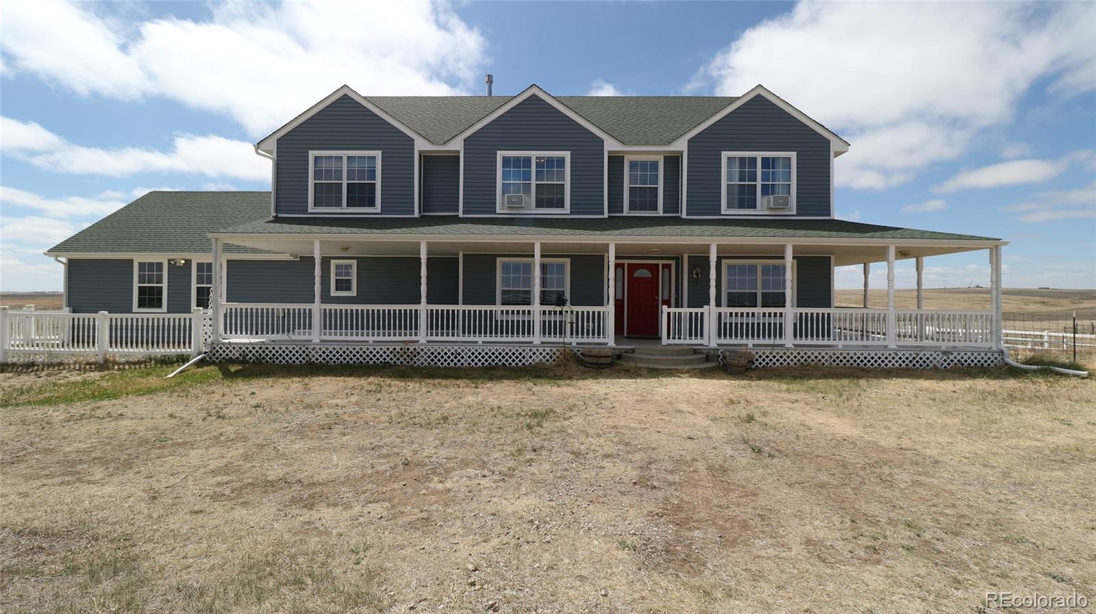 44166 East Iliff Trail Bennett, CO 80102 - Photo 2 of 50 front view of a house with a yard