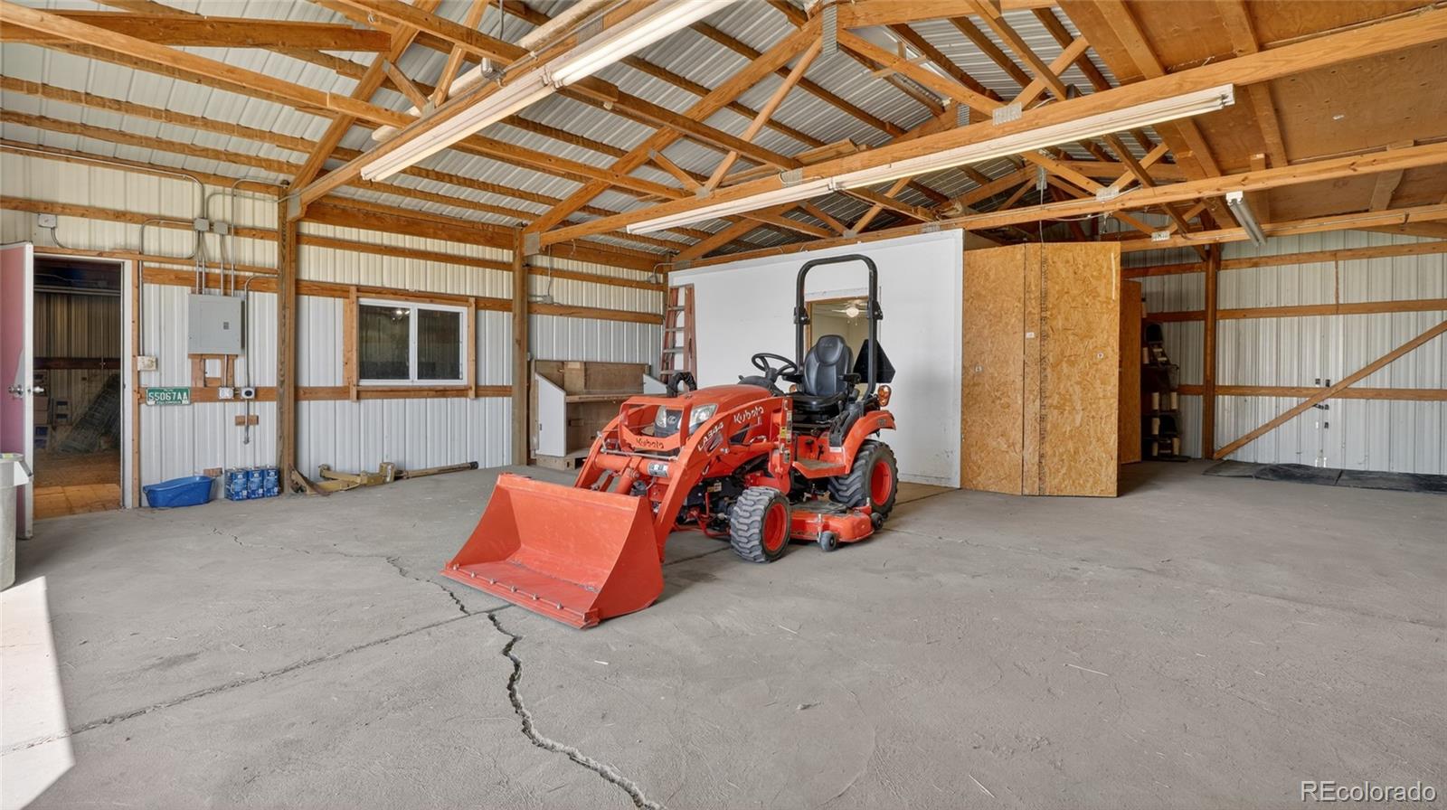 44166 East Iliff Trail Bennett, CO 80102 - Photo 40 of 50 a view of a storage room with furniture