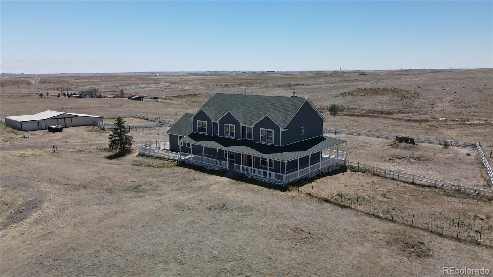 44166 East Iliff Trail Bennett, CO 80102 - Photo 4 of 50 an ocean view with beach
