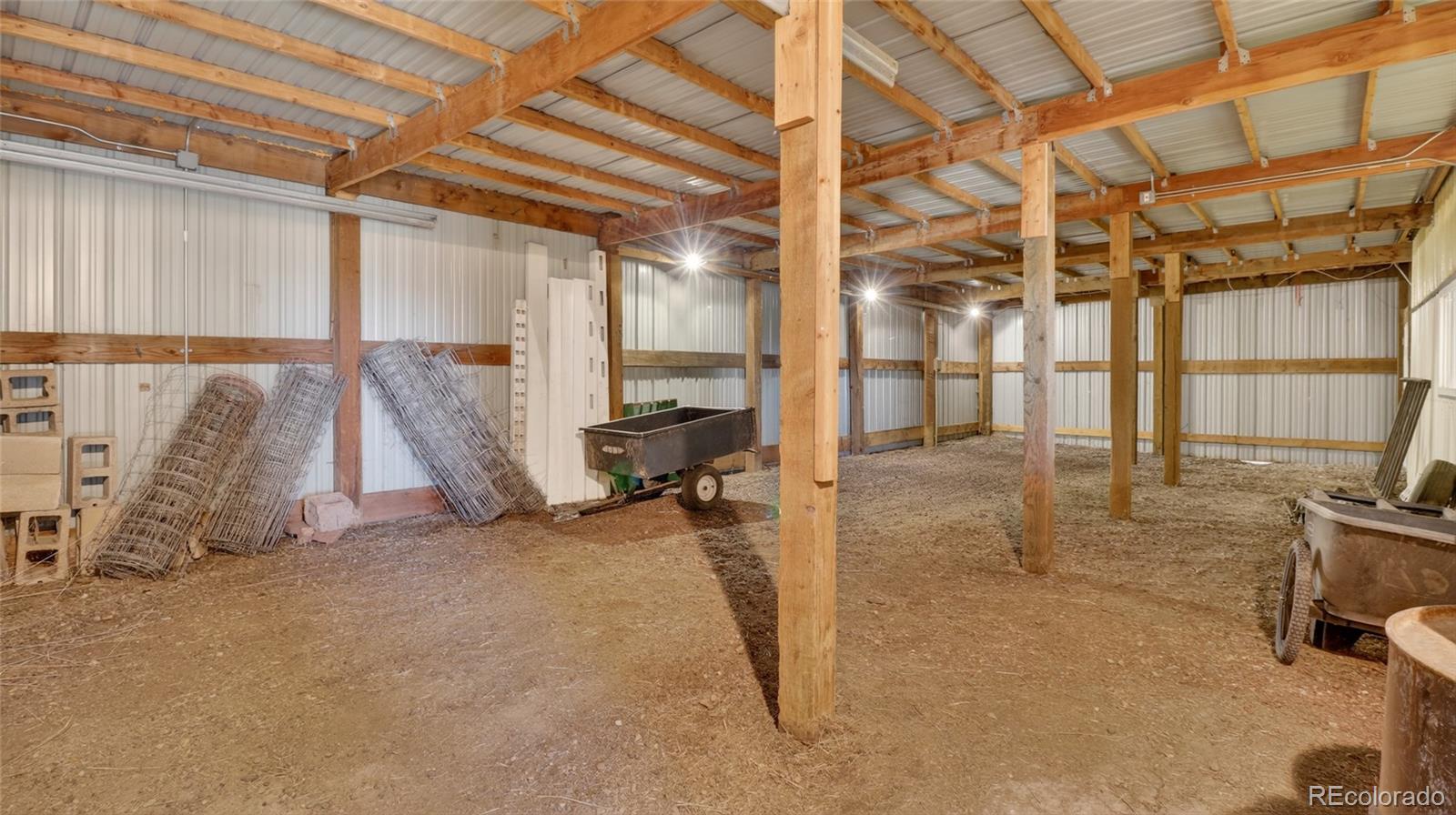 44166 East Iliff Trail Bennett, CO 80102 - Photo 41 of 50 a view of a room with gym equipment