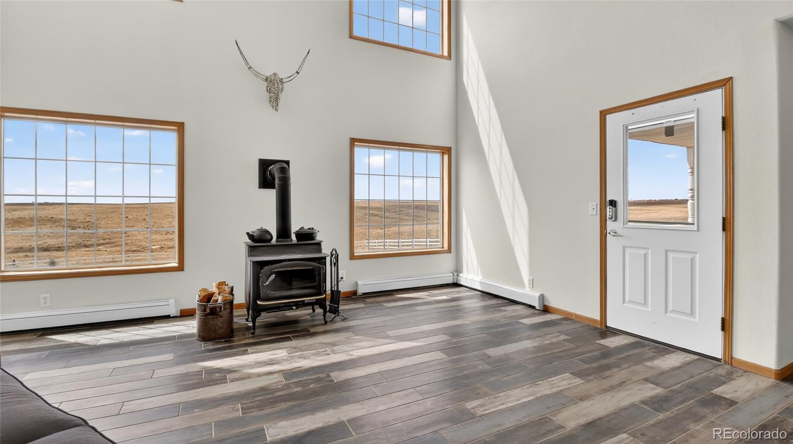 44166 East Iliff Trail Bennett, CO 80102 - Photo 43 of 50 a view of a livingroom with furniture and a window