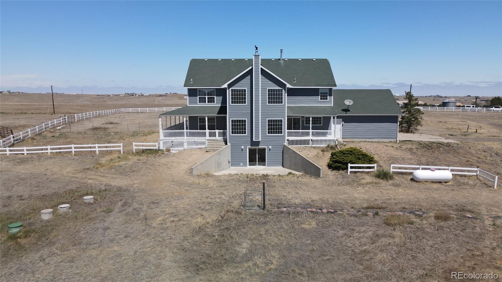 44166 East Iliff Trail Bennett, CO 80102 - Photo 5 of 50 an aerial view of a house with a yard and sitting area