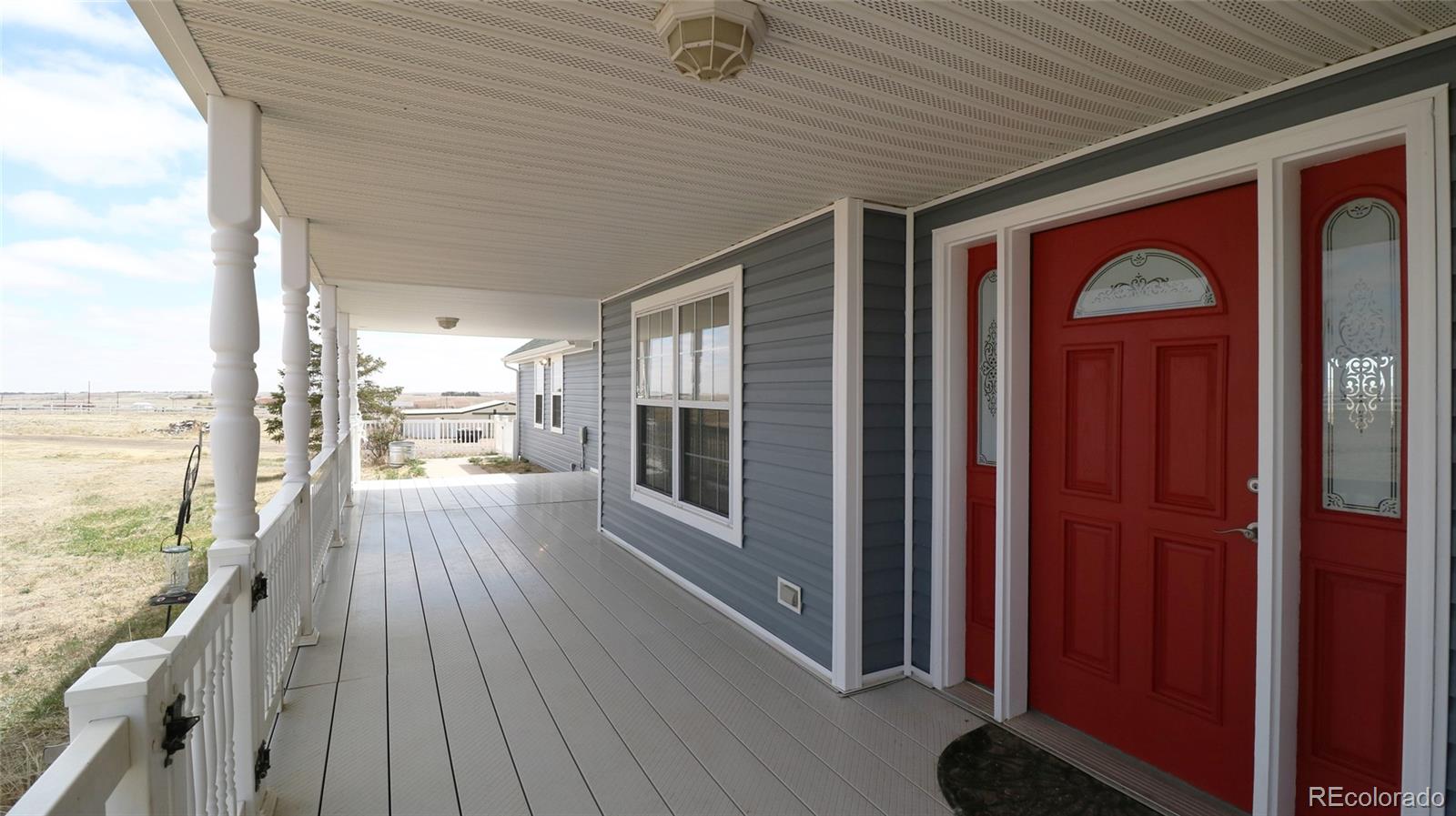 44166 East Iliff Trail Bennett, CO 80102 - Photo 6 of 50 a view of a patio with wooden floor and outdoor space