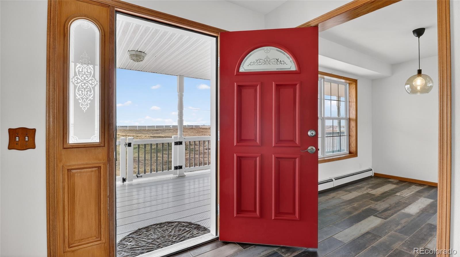 44166 East Iliff Trail Bennett, CO 80102 - Photo 7 of 50 a view of front door of a house