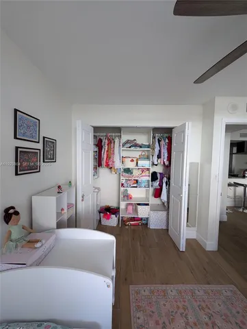 a bedroom with a bed and closet