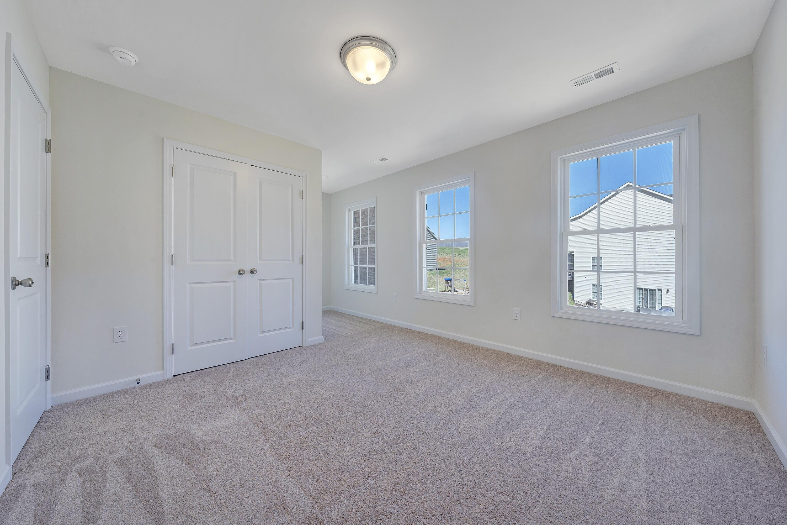3076 Isabel Lane Salem, VA 24153 - Photo 14 of 16 an empty room with windows and closet