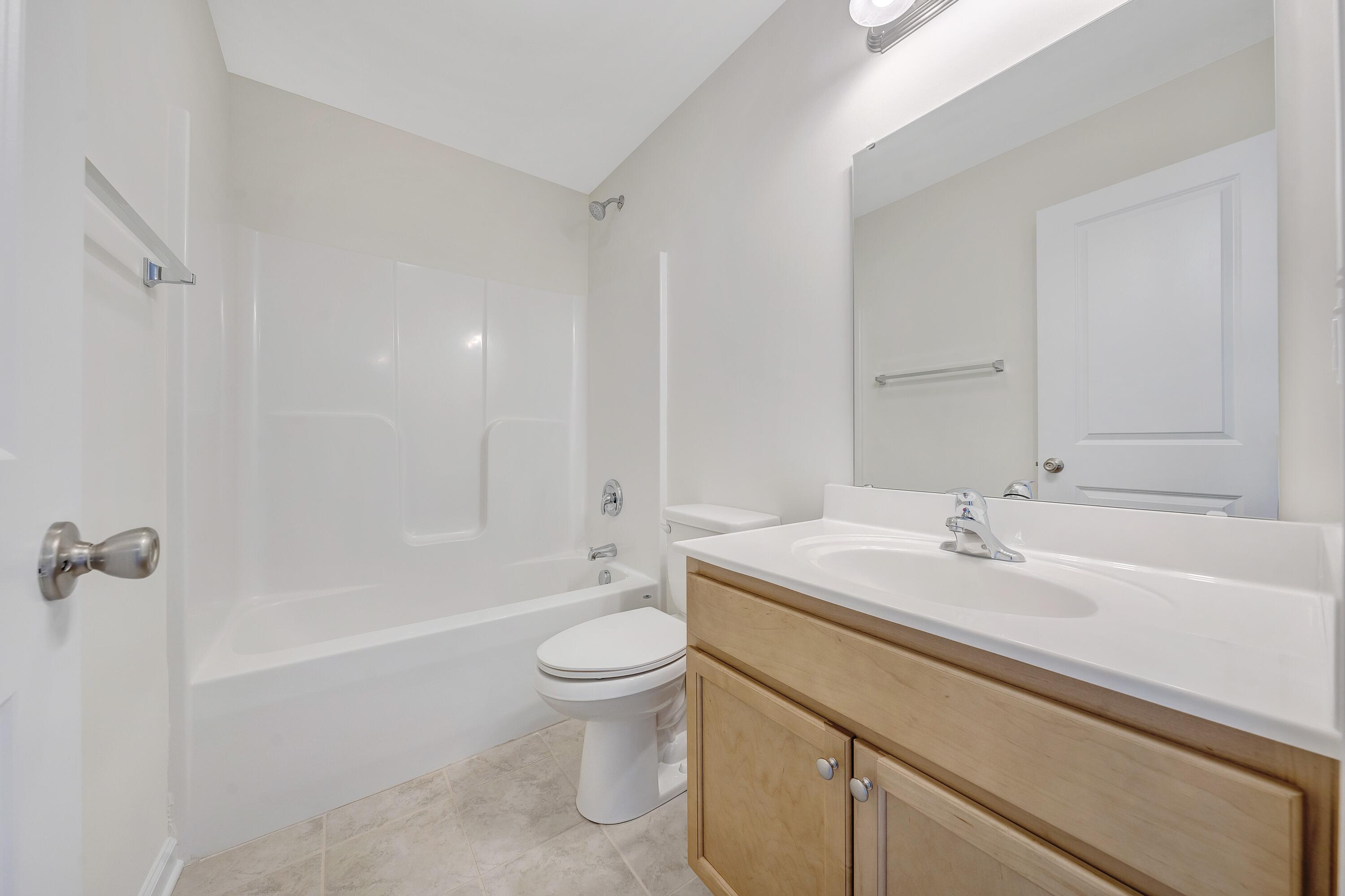 3076 Isabel Lane Salem, VA 24153 - Photo 15 of 16 a bathroom with a sink a toilet and shower