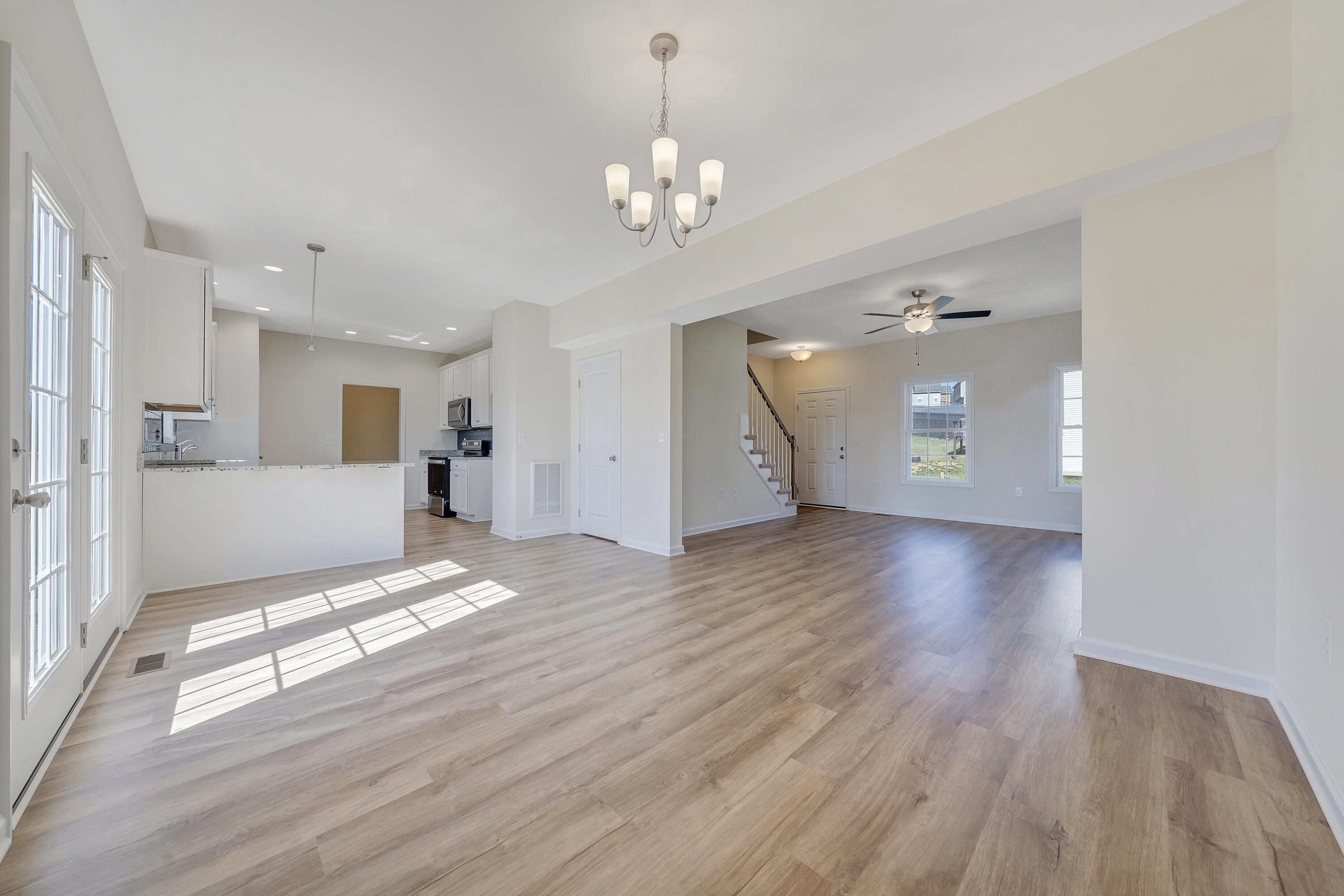 3076 Isabel Lane Salem, VA 24153 - Photo 4 of 16 a view of a livingroom with a chandelier