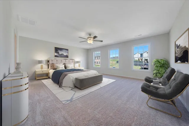 a bedroom with a large bed and a couch