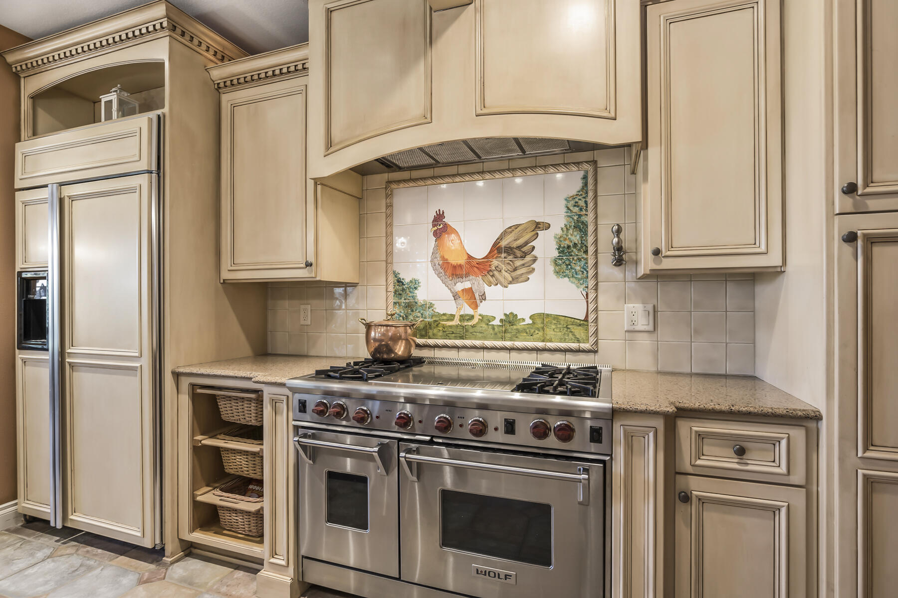 61445 Gosney Road Bend, OR 97702 - Photo 40 of 83 a kitchen with stainless steel appliances granite countertop white cabinets and a stove top oven