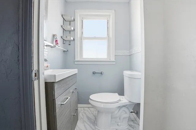 a kitchen with a refrigerator and a stove top oven