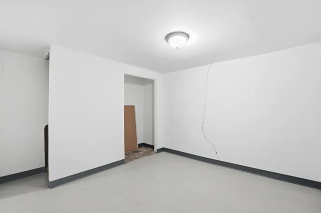 a view of a chairs and table in the balcony