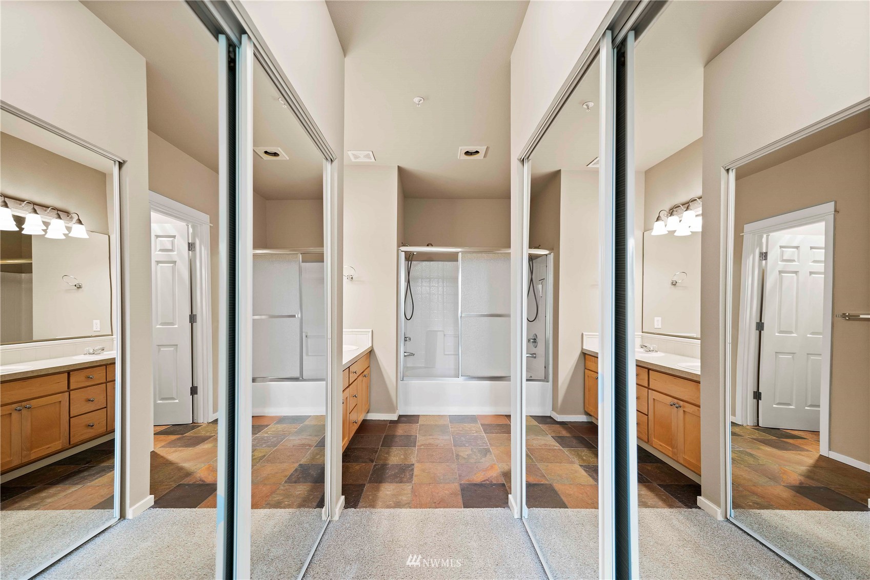 2009 196th Street Southeast, Unit D201 Bothell, WA 98012 - Photo 13 of 30 a bathroom with a glass shower door and a glass door
