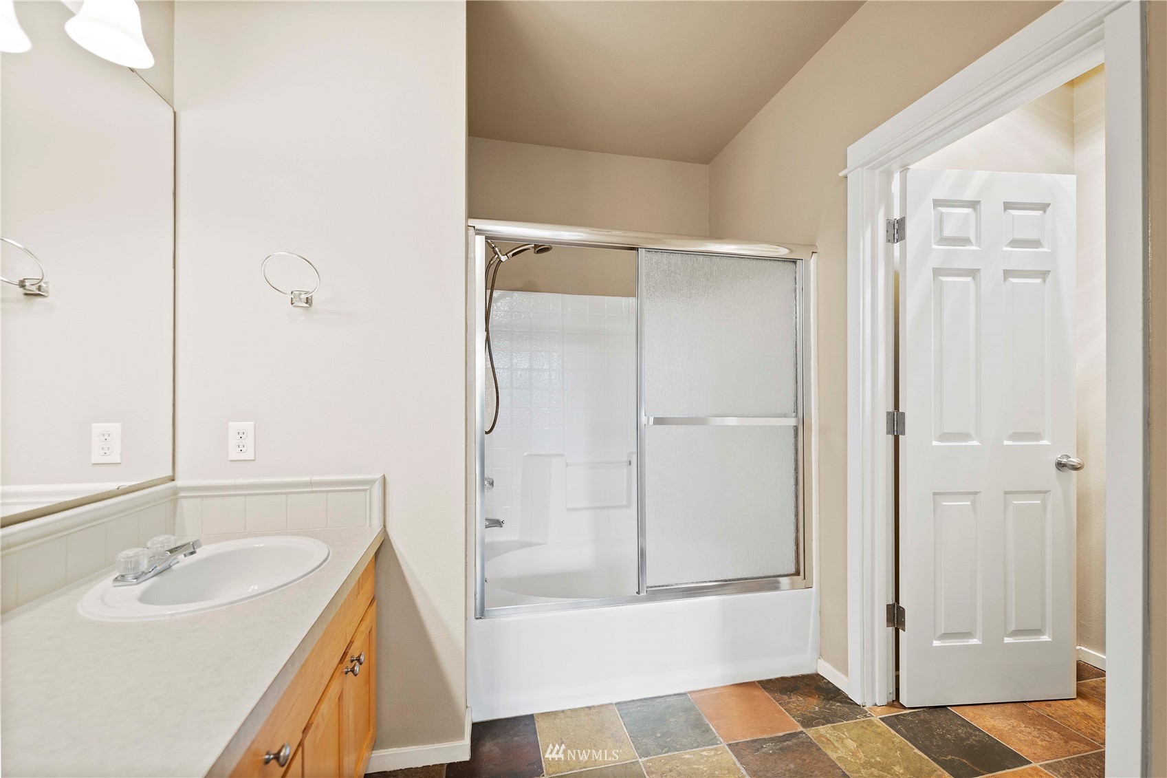 2009 196th Street Southeast, Unit D201 Bothell, WA 98012 - Photo 14 of 30 a bathroom with a sink a toilet and shower