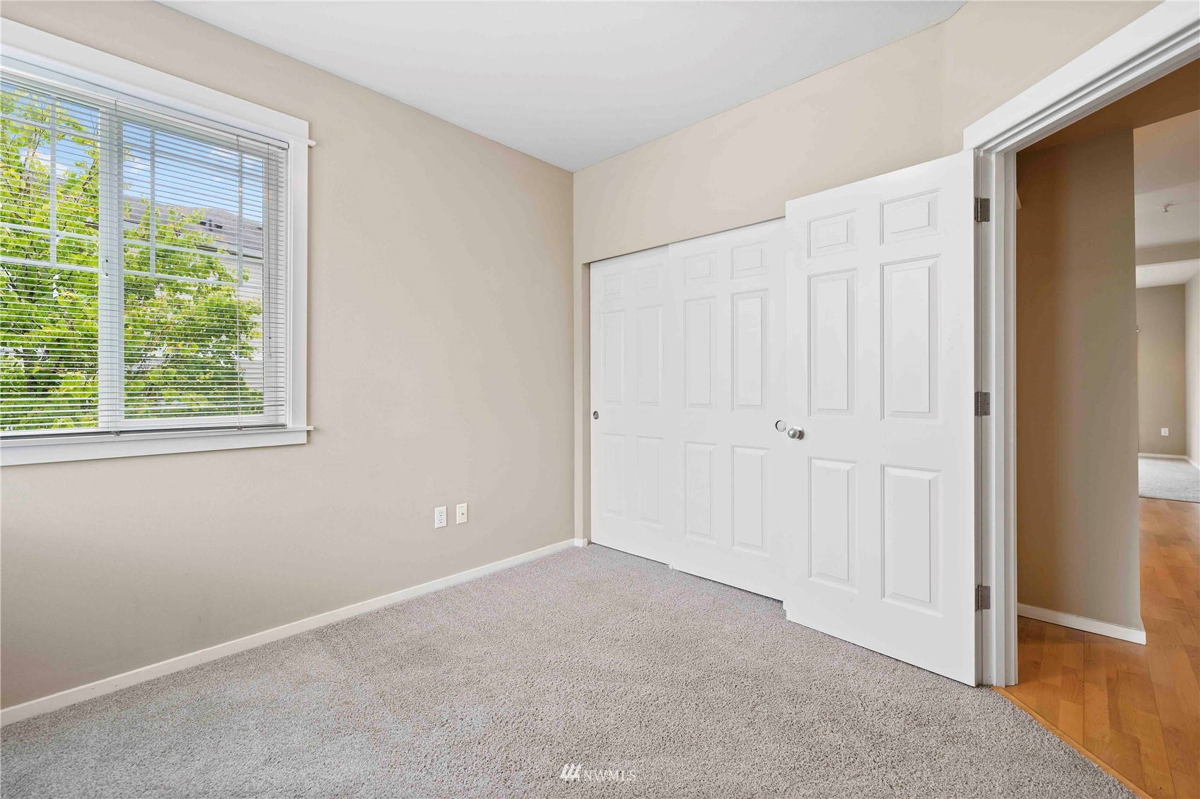 2009 196th Street Southeast, Unit D201 Bothell, WA 98012 - Photo 17 of 30 an empty room with windows and closet