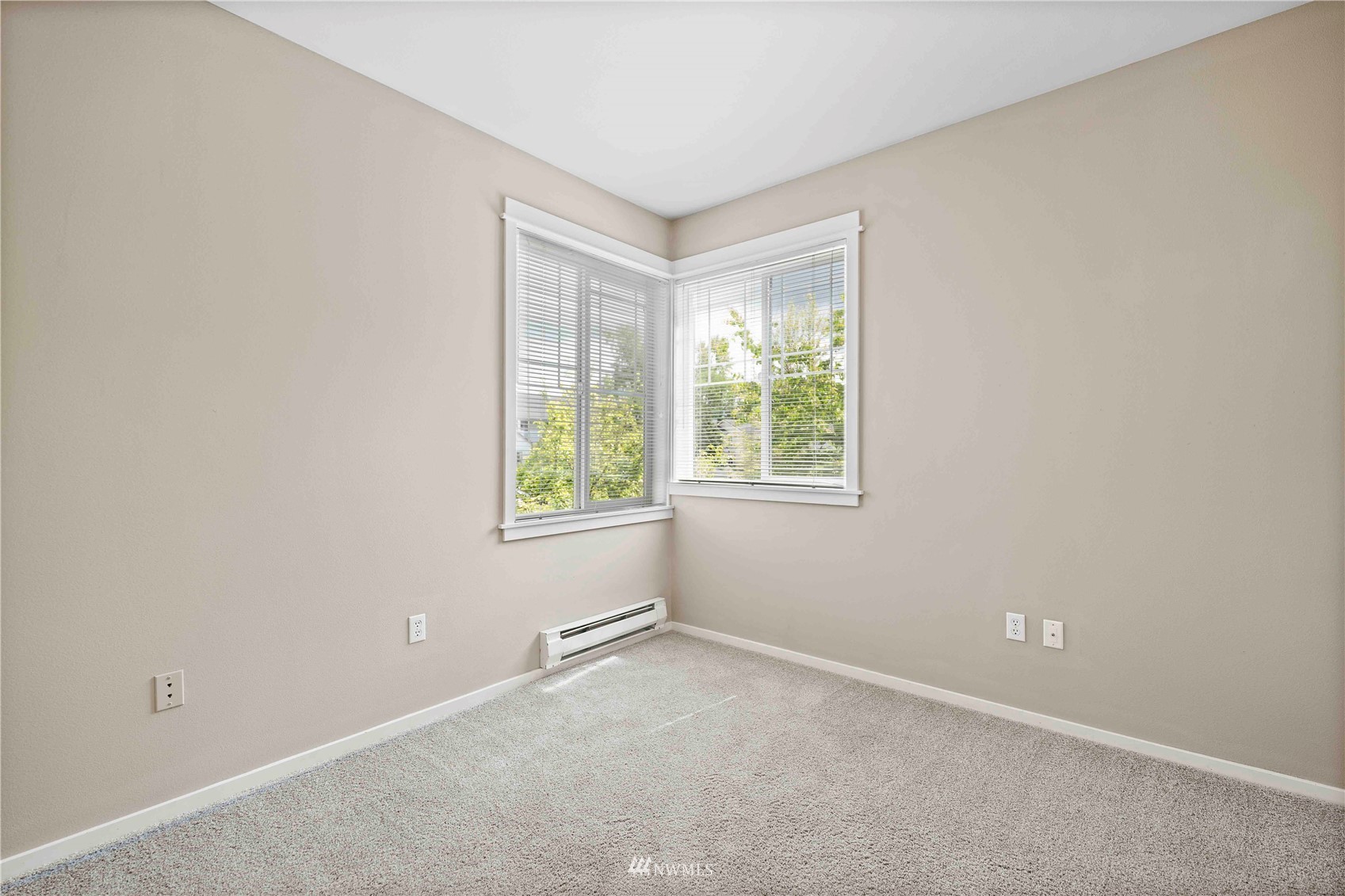 2009 196th Street Southeast, Unit D201 Bothell, WA 98012 - Photo 18 of 30 an empty room with windows