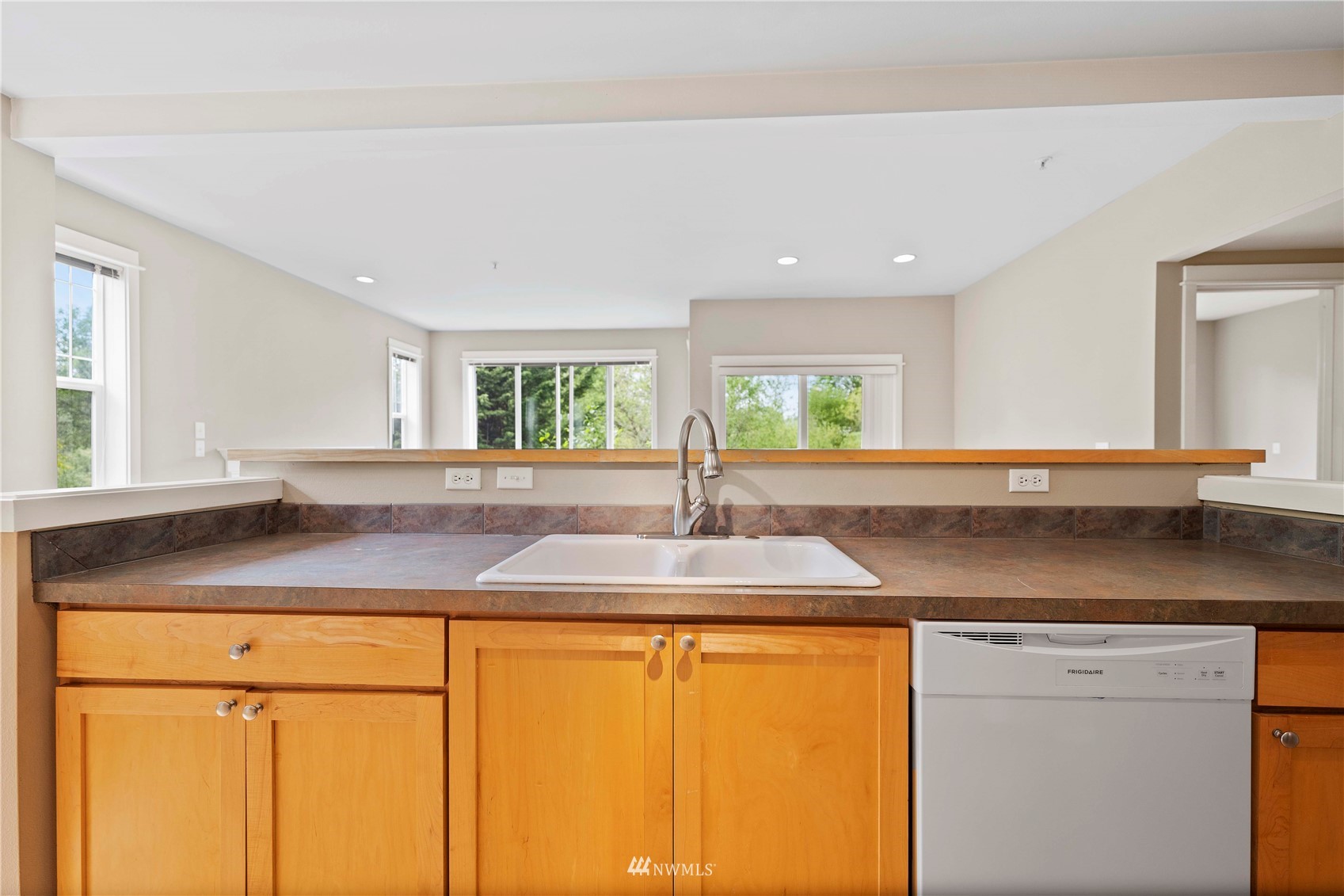 2009 196th Street Southeast, Unit D201 Bothell, WA 98012 - Photo 5 of 30 a kitchen with granite countertop cabinets and window