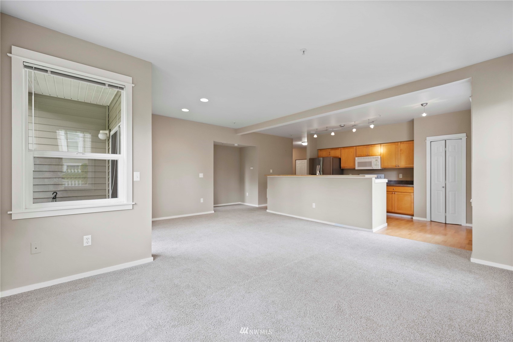 2009 196th Street Southeast, Unit D201 Bothell, WA 98012 - Photo 9 of 30 a view of an empty room and a window