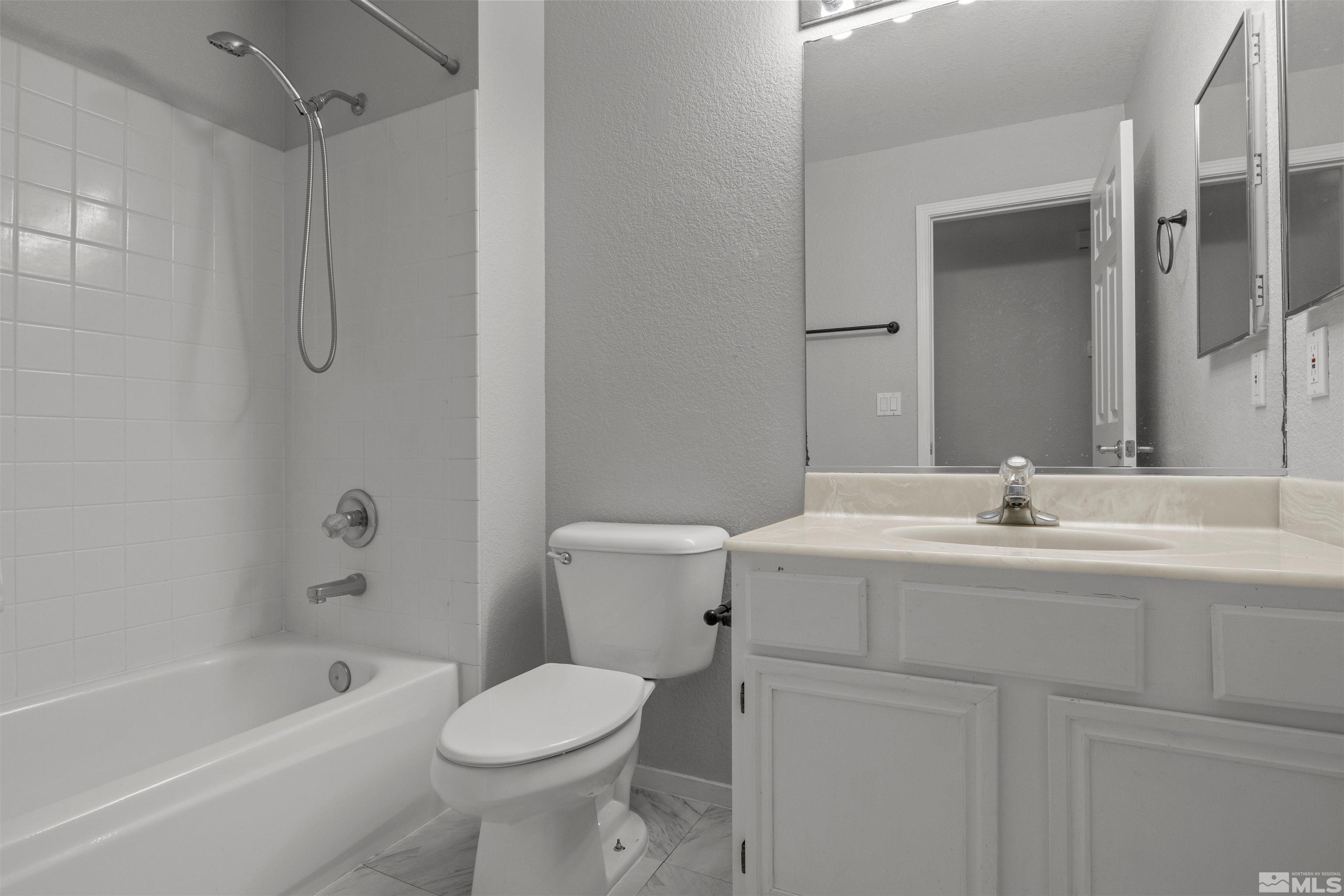 1990 Honey Ridge Drive Reno, NV 89511 - Photo 19 of 24 a bathroom with a sink toilet and shower
