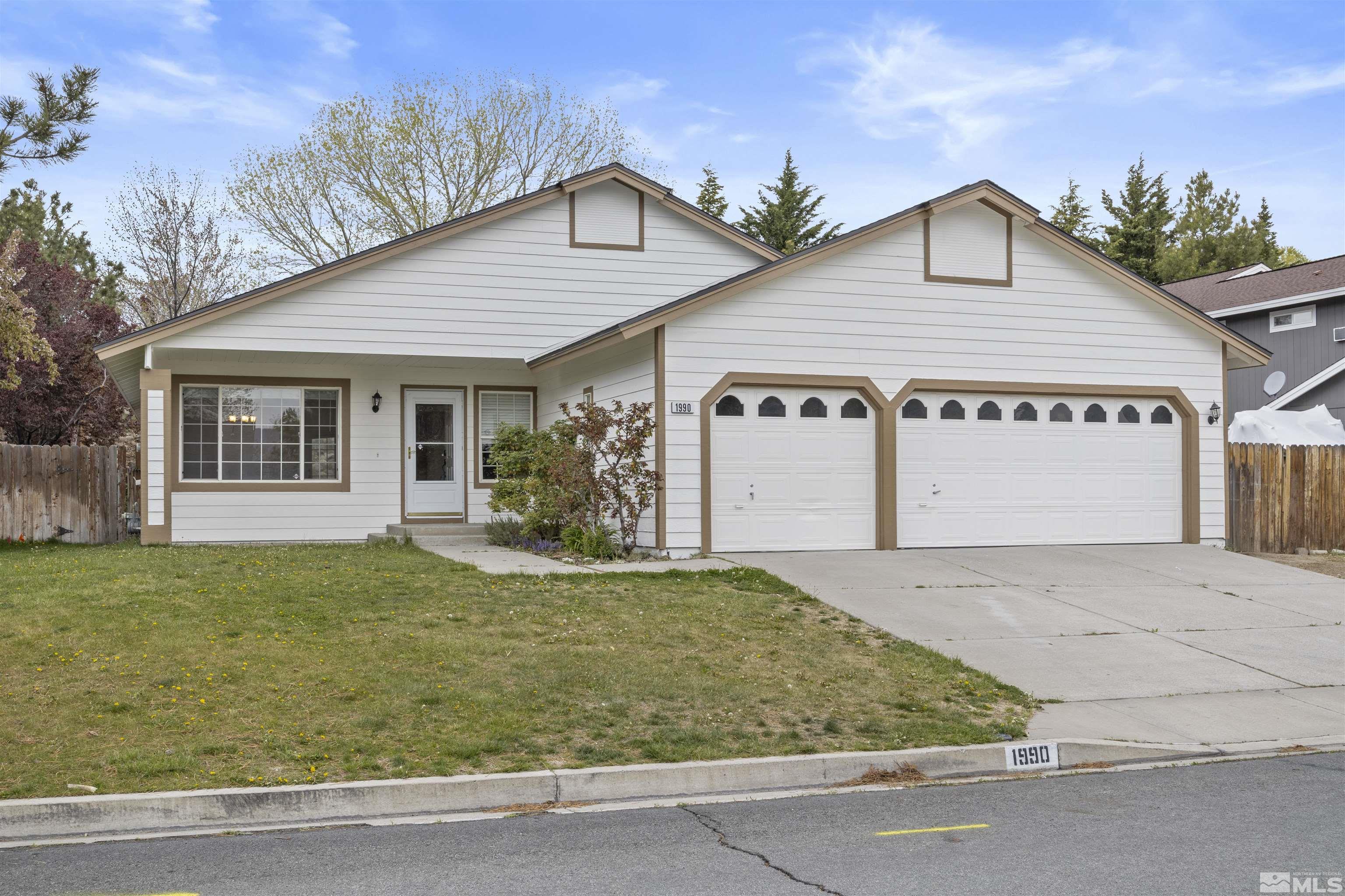 1990 Honey Ridge Drive Reno, NV 89511 - Photo 2 of 24 front view of a house with a yard
