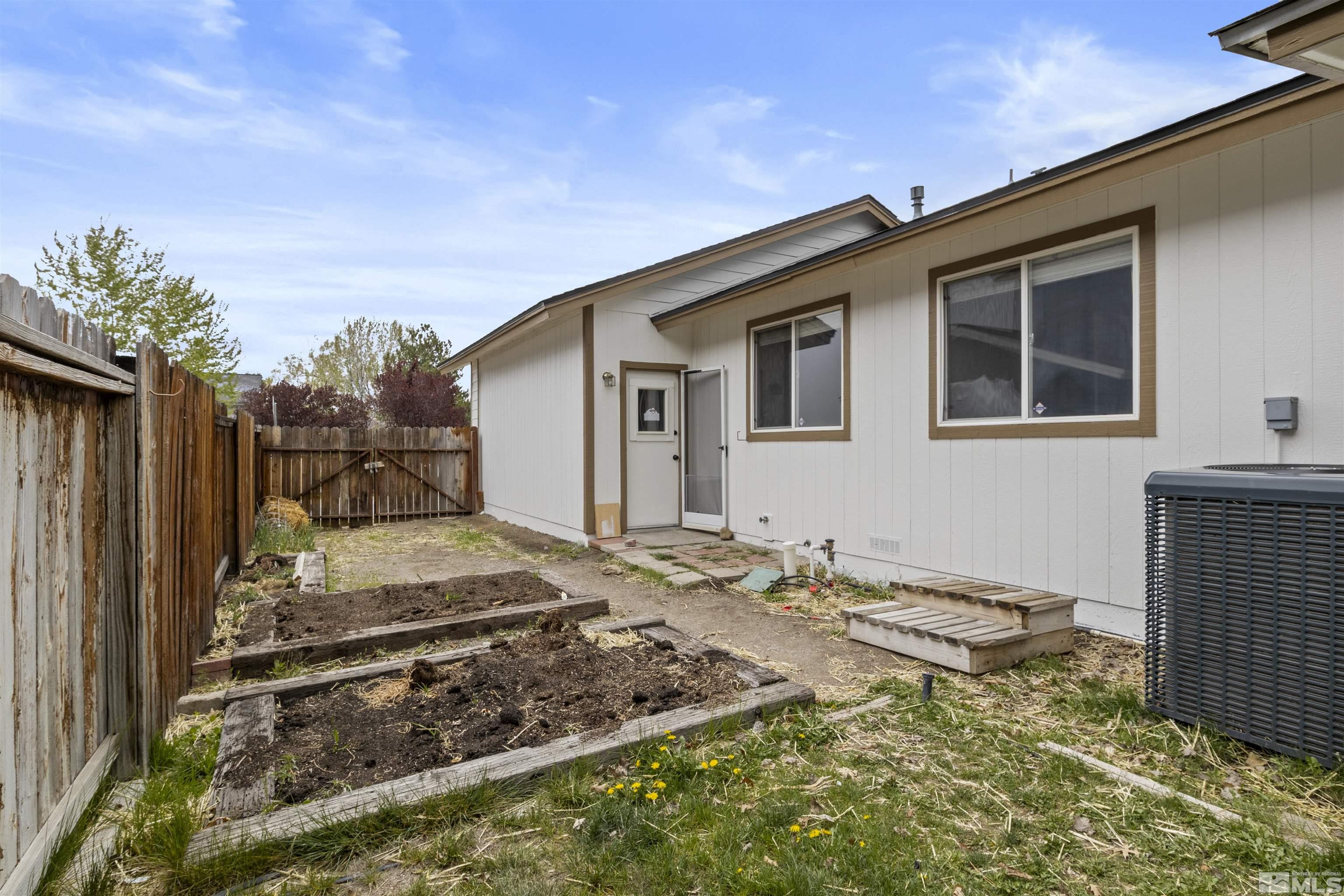 1990 Honey Ridge Drive Reno, NV 89511 - Photo 24 of 24 a front view of a house with a yard