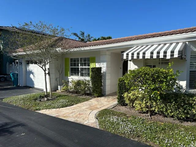 a swimming pool with outdoor seating and yard