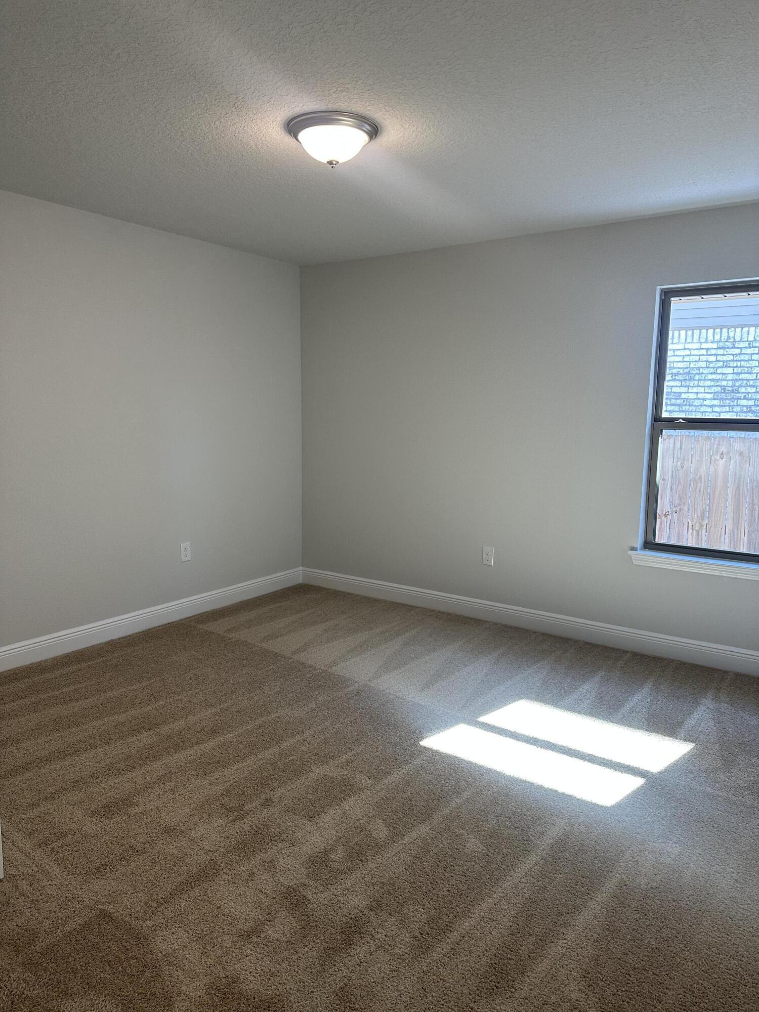 329 Keswick Lane Crestview, FL 32536 - Photo 11 of 22 an empty room with a empty space and windows