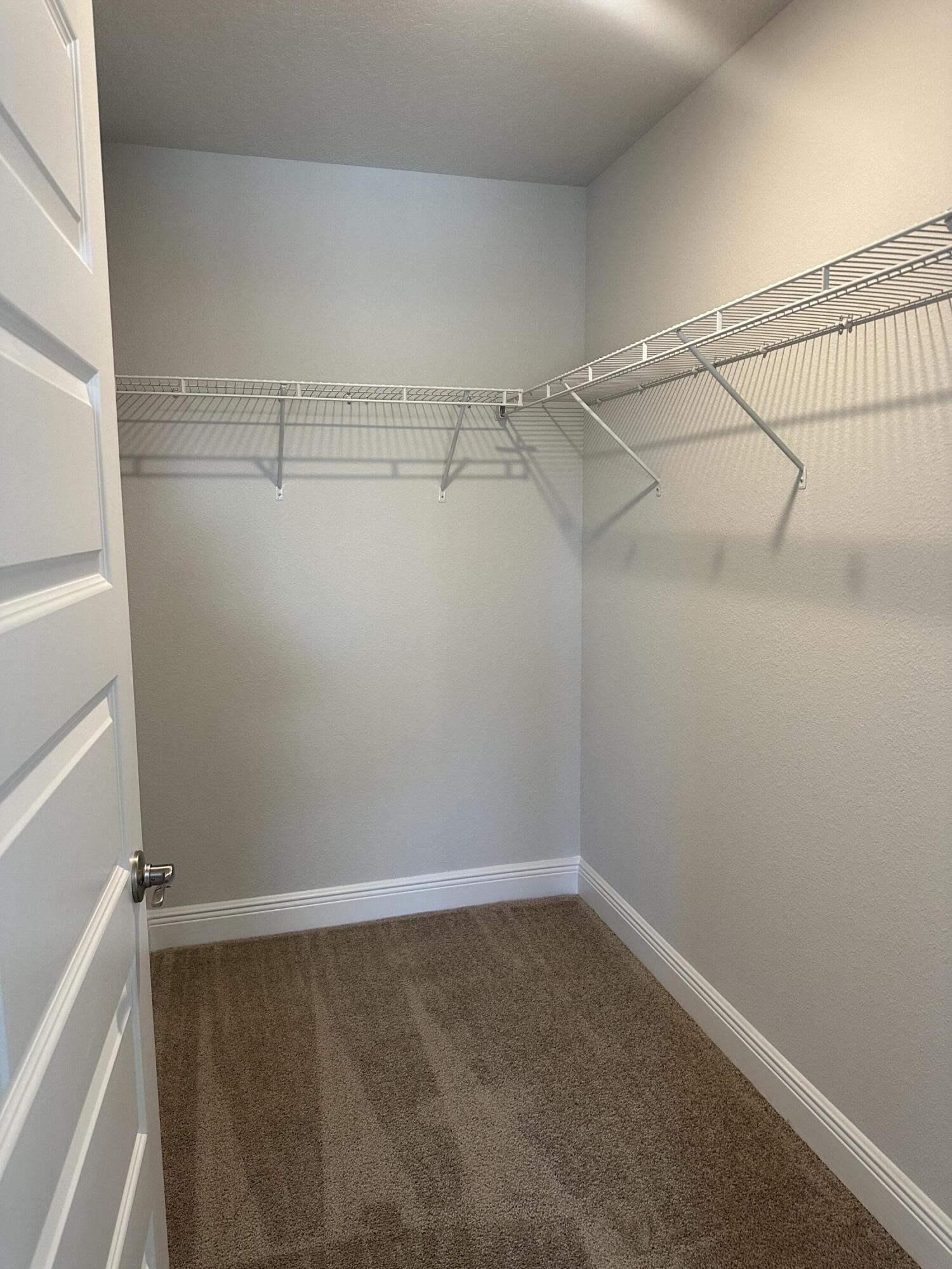 329 Keswick Lane Crestview, FL 32536 - Photo 17 of 22 a view of a room with racks on the wall