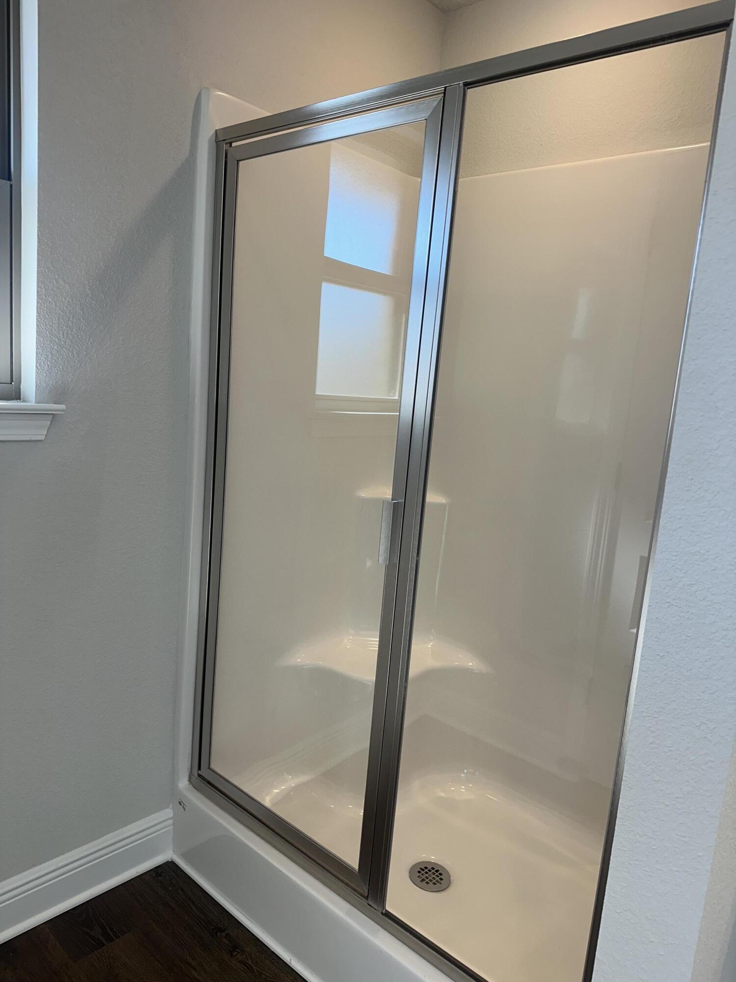 329 Keswick Lane Crestview, FL 32536 - Photo 19 of 22 a bathroom with a glass shower door