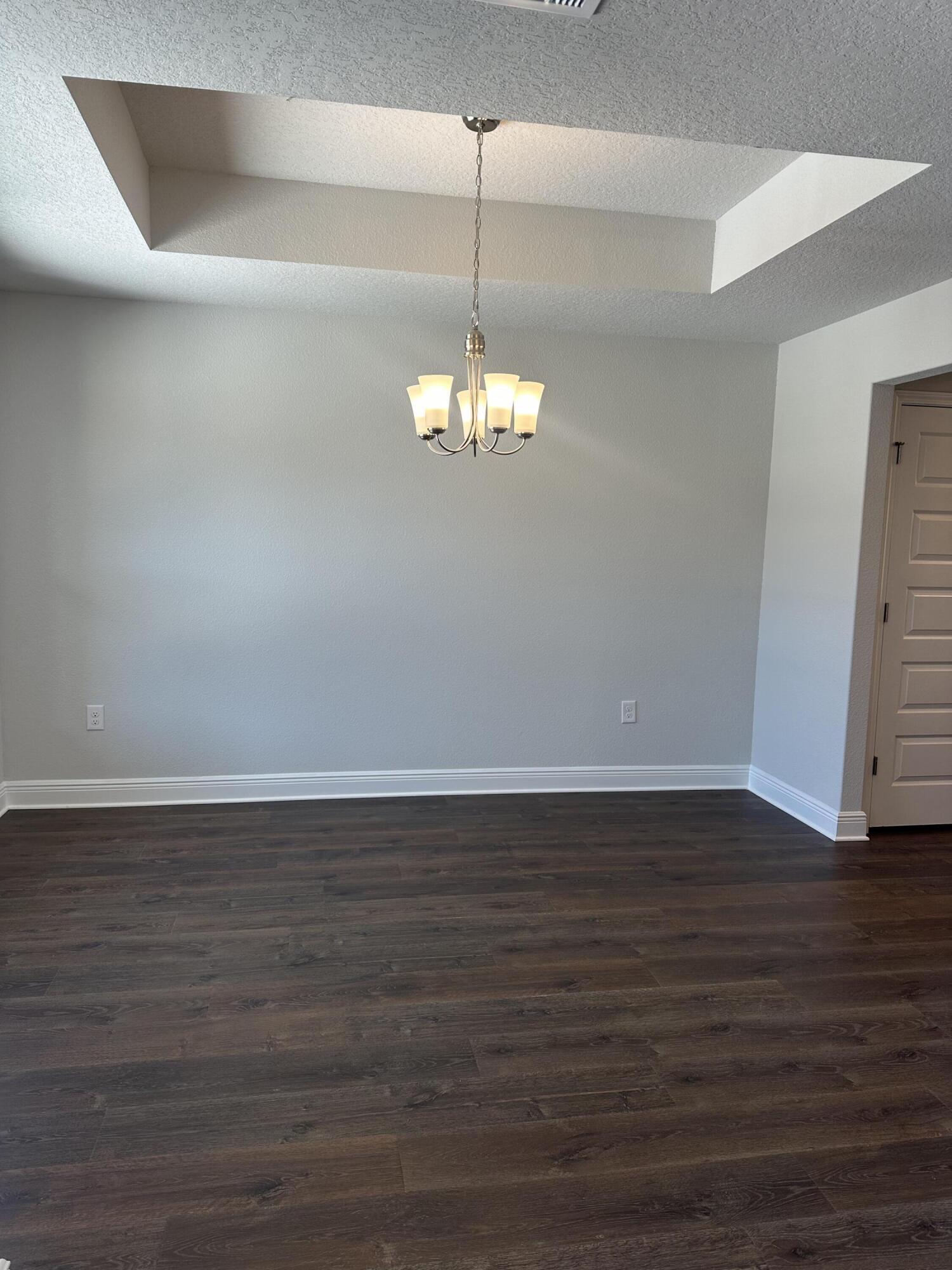 329 Keswick Lane Crestview, FL 32536 - Photo 4 of 22 a view of a room with wooden floor and windows