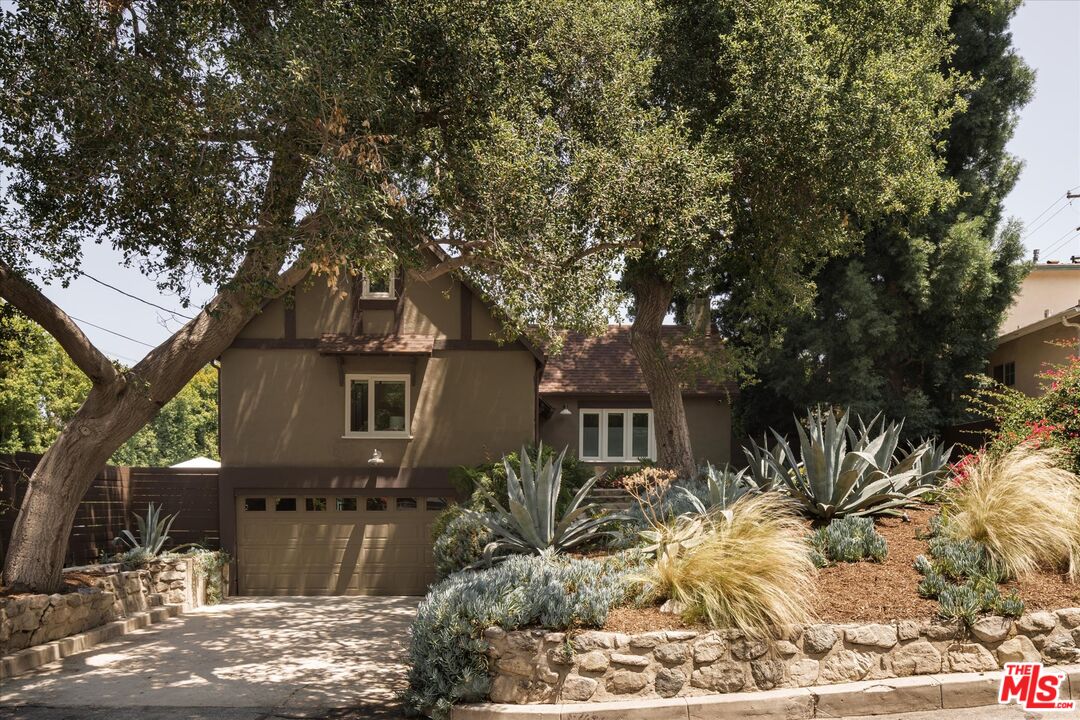 a view of house with yard