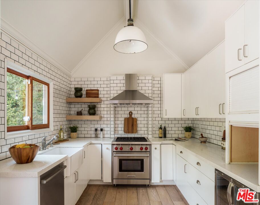 1767 Hillside Drive Glendale, CA 91208 - Photo 14 of 51 a kitchen with stainless steel appliances a stove sink and cabinets