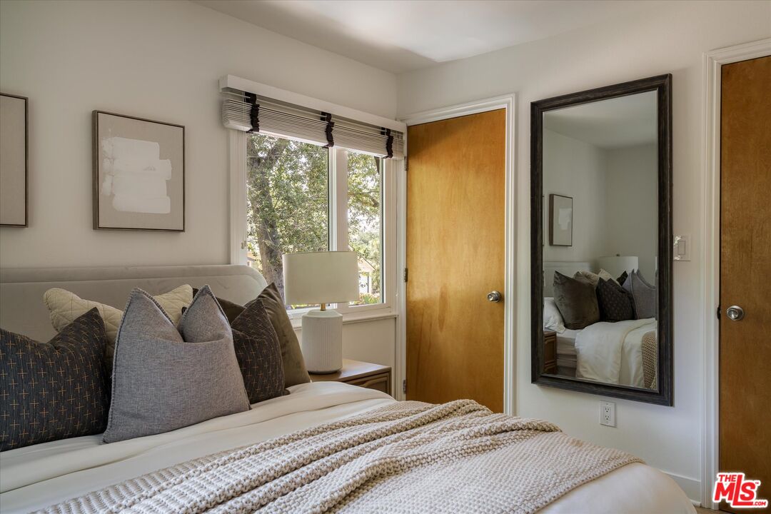 1767 Hillside Drive Glendale, CA 91208 - Photo 16 of 51 a bedroom with a bed and a window
