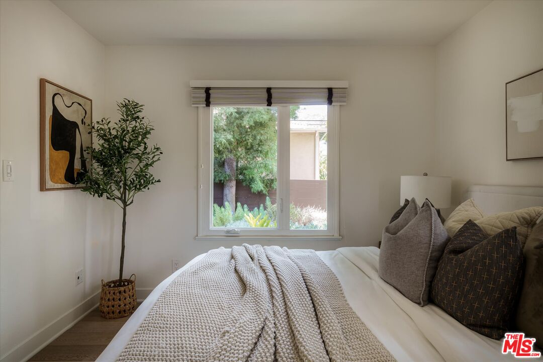 1767 Hillside Drive Glendale, CA 91208 - Photo 17 of 51 a bedroom with a bed and a window