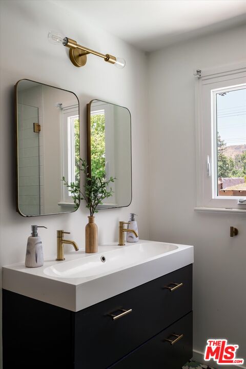 1767 Hillside Drive Glendale, CA 91208 - Photo 20 of 51 a bathroom with a sink and a mirror