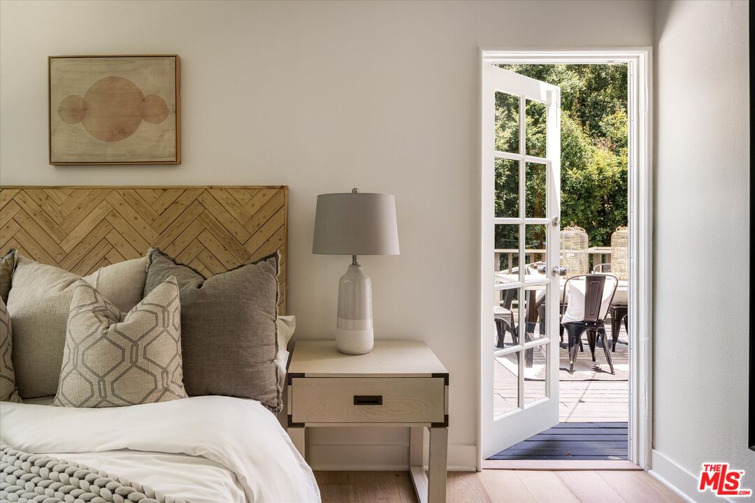 1767 Hillside Drive Glendale, CA 91208 - Photo 25 of 51 a bedroom with a bed and glass window