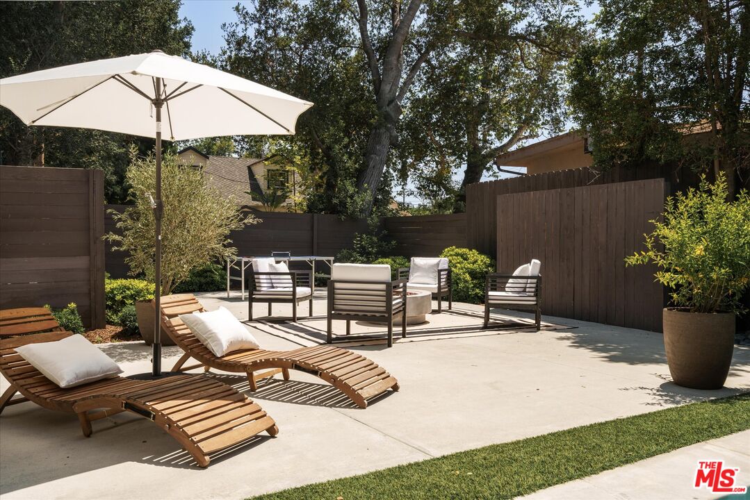 1767 Hillside Drive Glendale, CA 91208 - Photo 42 of 51 a view of a terrace with furniture and an umbrella
