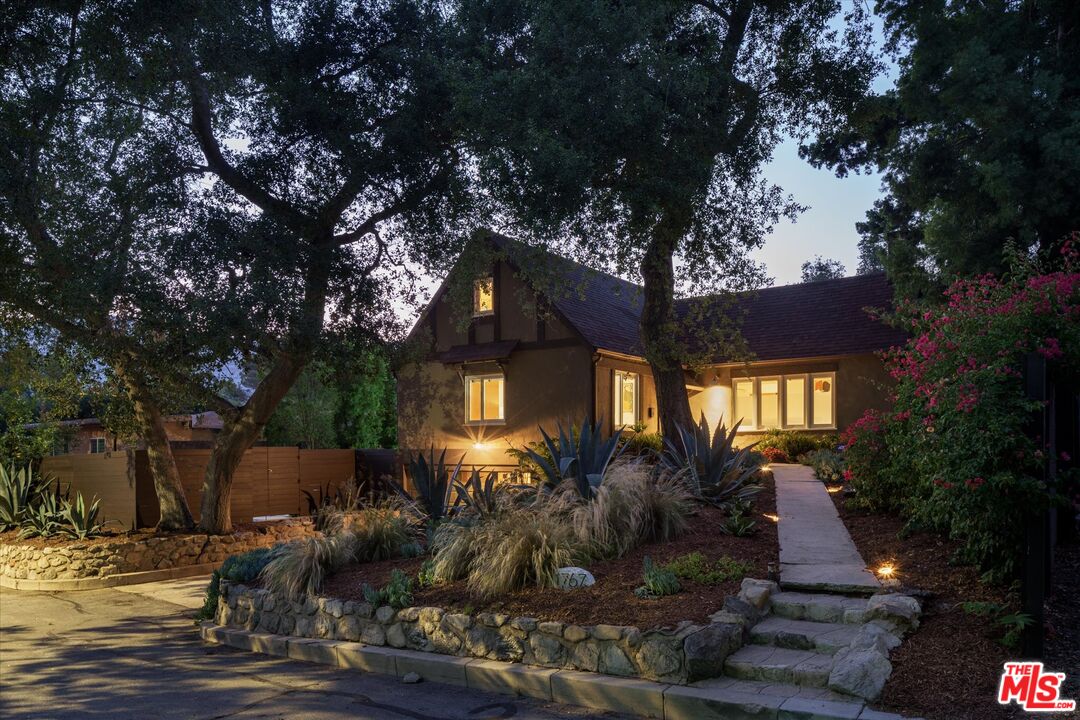1767 Hillside Drive Glendale, CA 91208 - Photo 45 of 51 a front view of a house with a yard and tree s