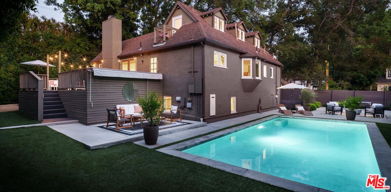 1767 Hillside Drive Glendale, CA 91208 - Photo 50 of 51 a view of a backyard with table and chairs potted plants and a large tree