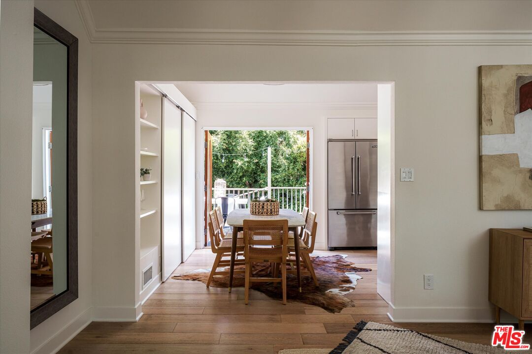 1767 Hillside Drive Glendale, CA 91208 - Photo 10 of 51 a dining room with furniture and a floor to ceiling window