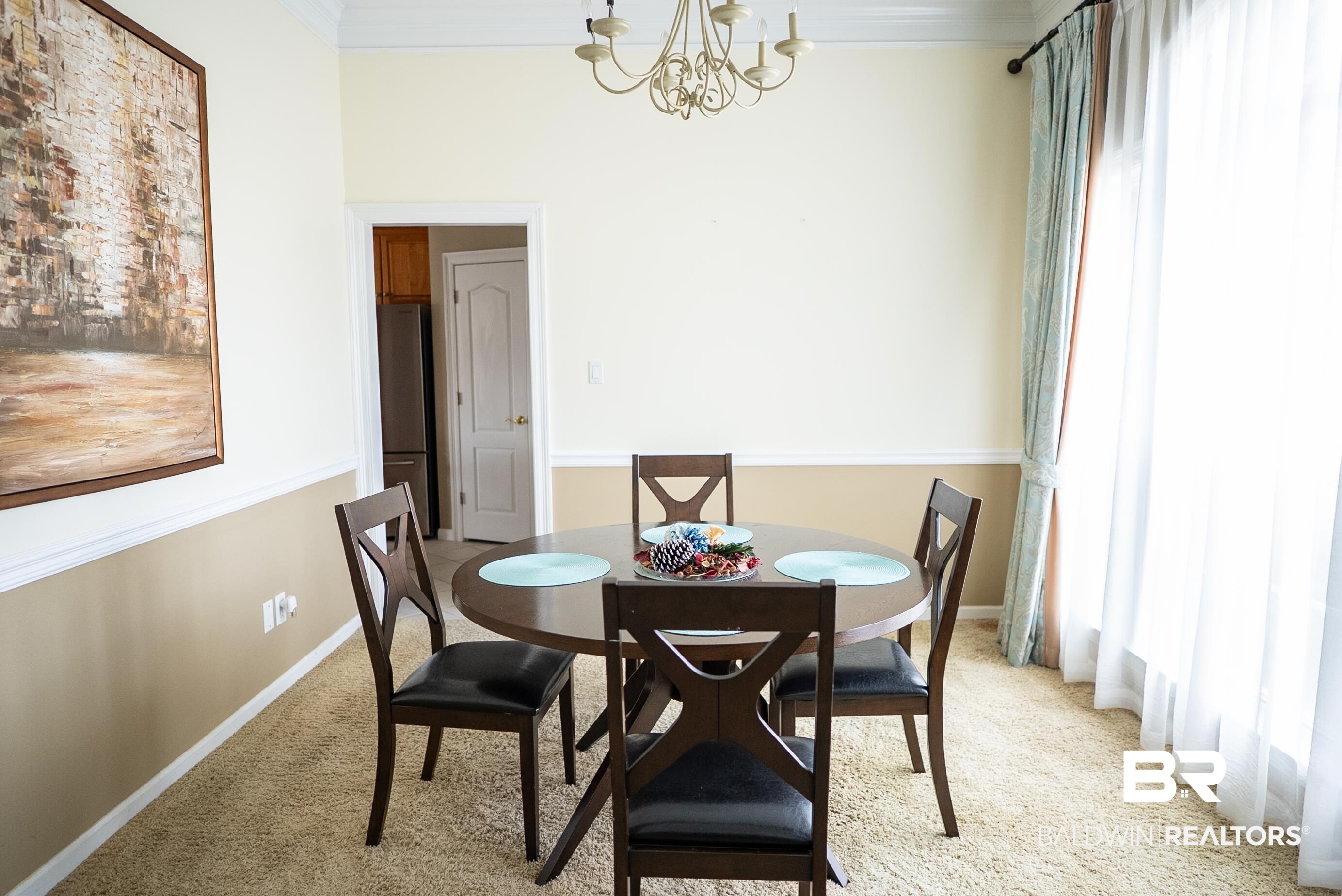 10023 Springfield Court Mobile, AL 36695 - Photo 8 of 50 Carpeted dining room with a chandelier and crown molding