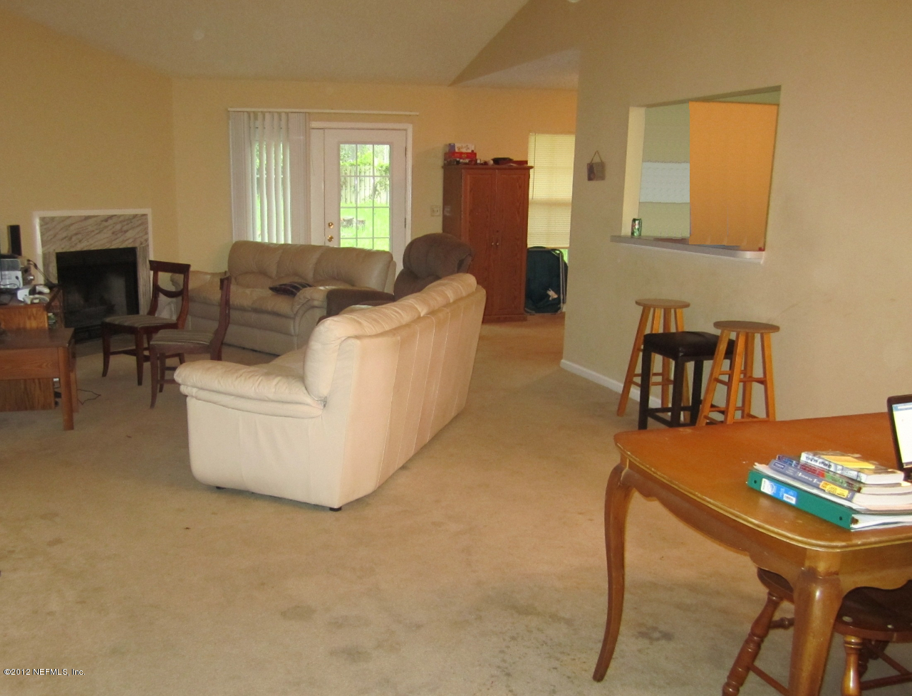 2047 Matefield Road Jacksonville, FL 32225 - Photo 2 of 4 a living room with furniture and a flat screen tv