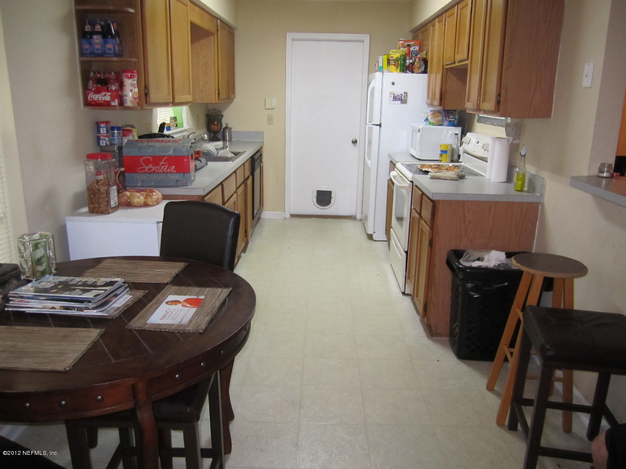 2047 Matefield Road Jacksonville, FL 32225 - Photo 4 of 4 a kitchen with stainless steel appliances granite countertop a sink a stove a dining table and chairs