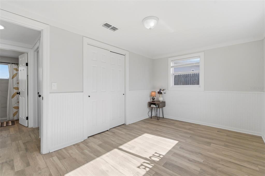 9033 Pegasus Avenue Port Richey, FL 34668 - Photo 25 of 56 wooden floor in an empty room