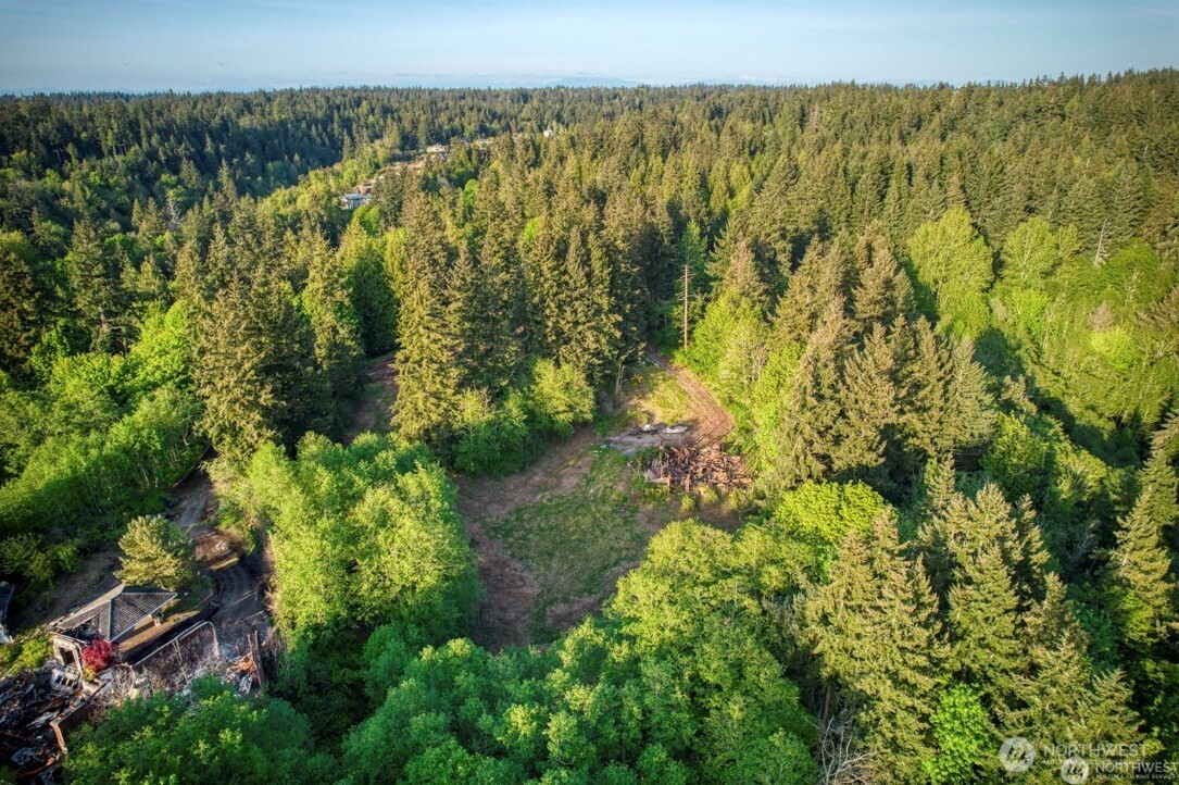 6920 Fisher Road Edmonds, WA 98026 - Photo 4 of 9 a view of a lake with a building in the background