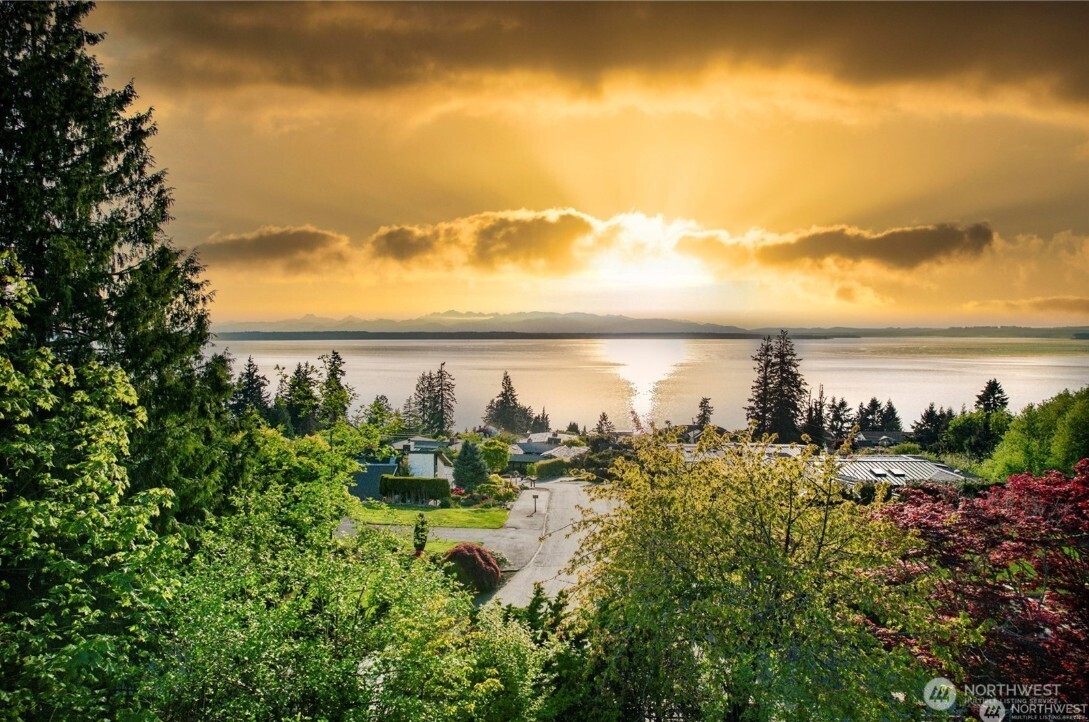 6920 Fisher Road Edmonds, WA 98026 - Photo 9 of 9 a view of a lake with a mountain in the background