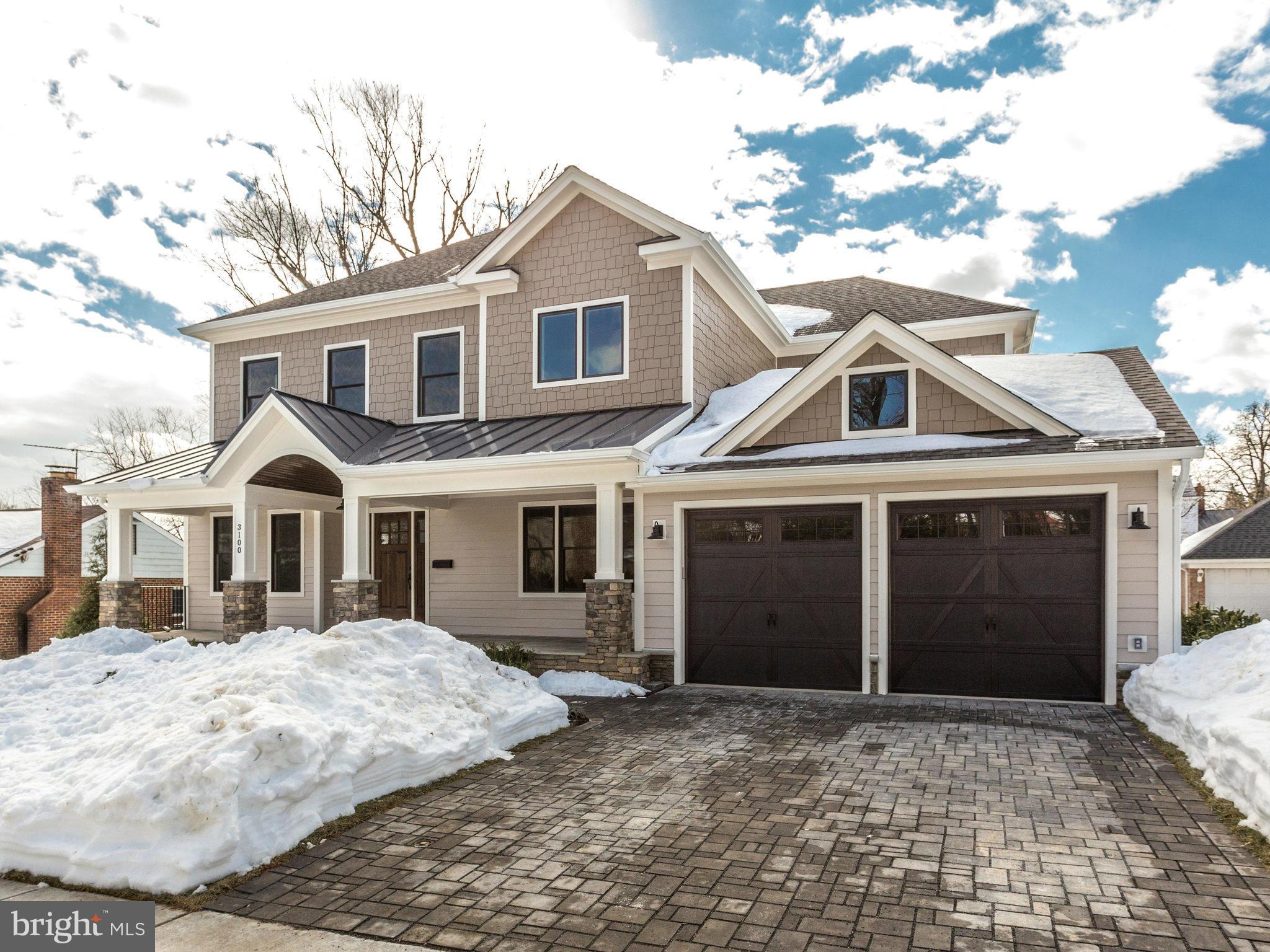3100 North Rochester Street Arlington, VA 22213 - Photo 2 of 30 a front view of a house with a yard and garage