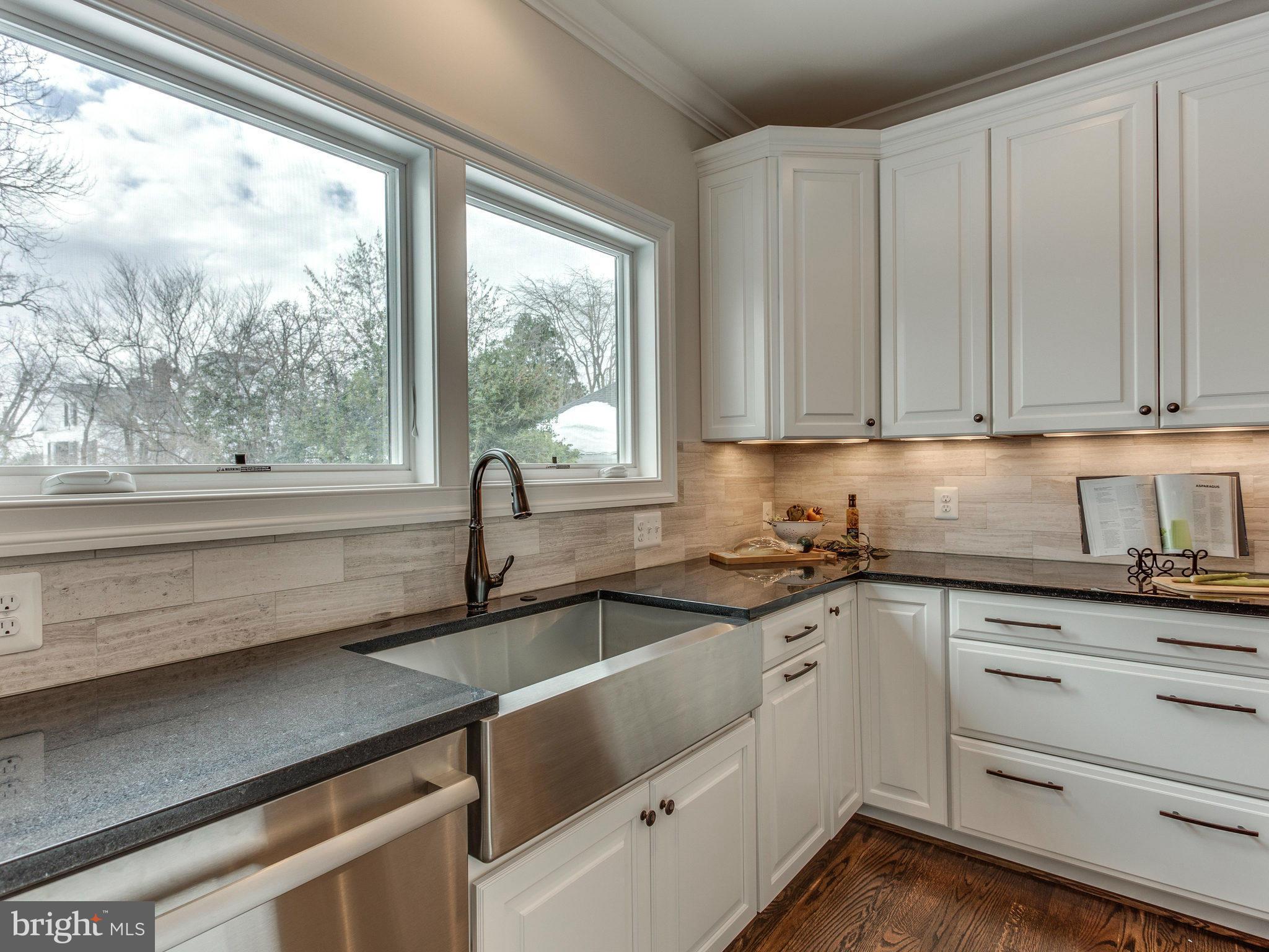 3100 North Rochester Street Arlington, VA 22213 - Photo 13 of 30 a kitchen with granite countertop a sink and cabinets