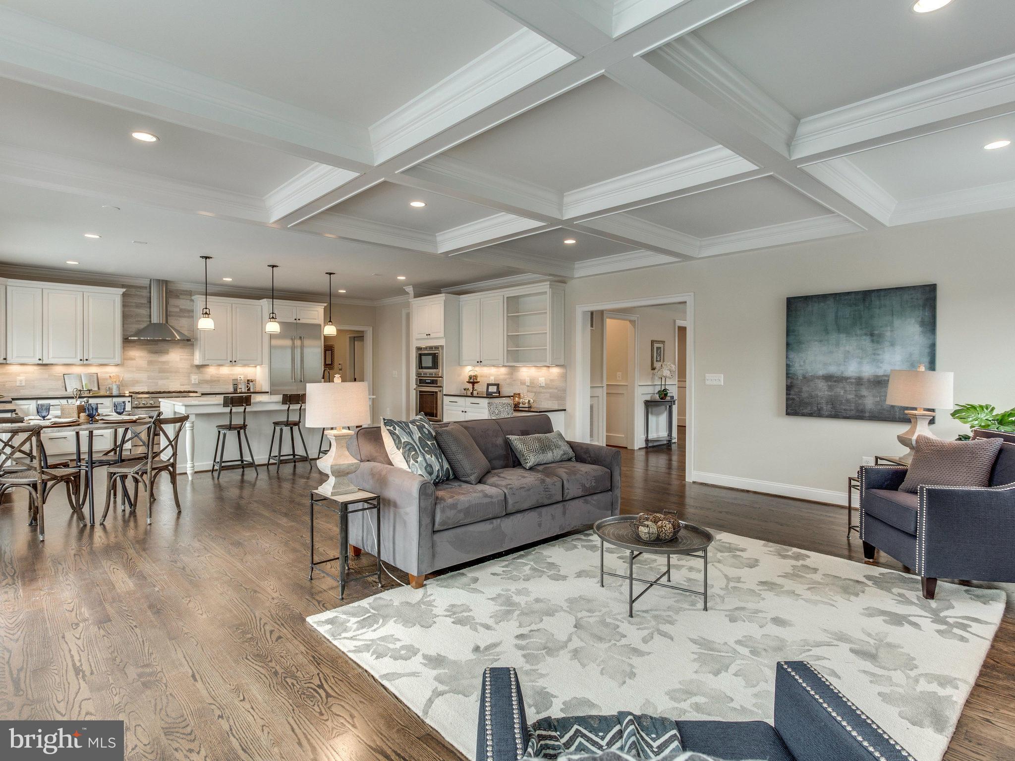 3100 North Rochester Street Arlington, VA 22213 - Photo 17 of 30 a living room with furniture and a dining table with wooden floor