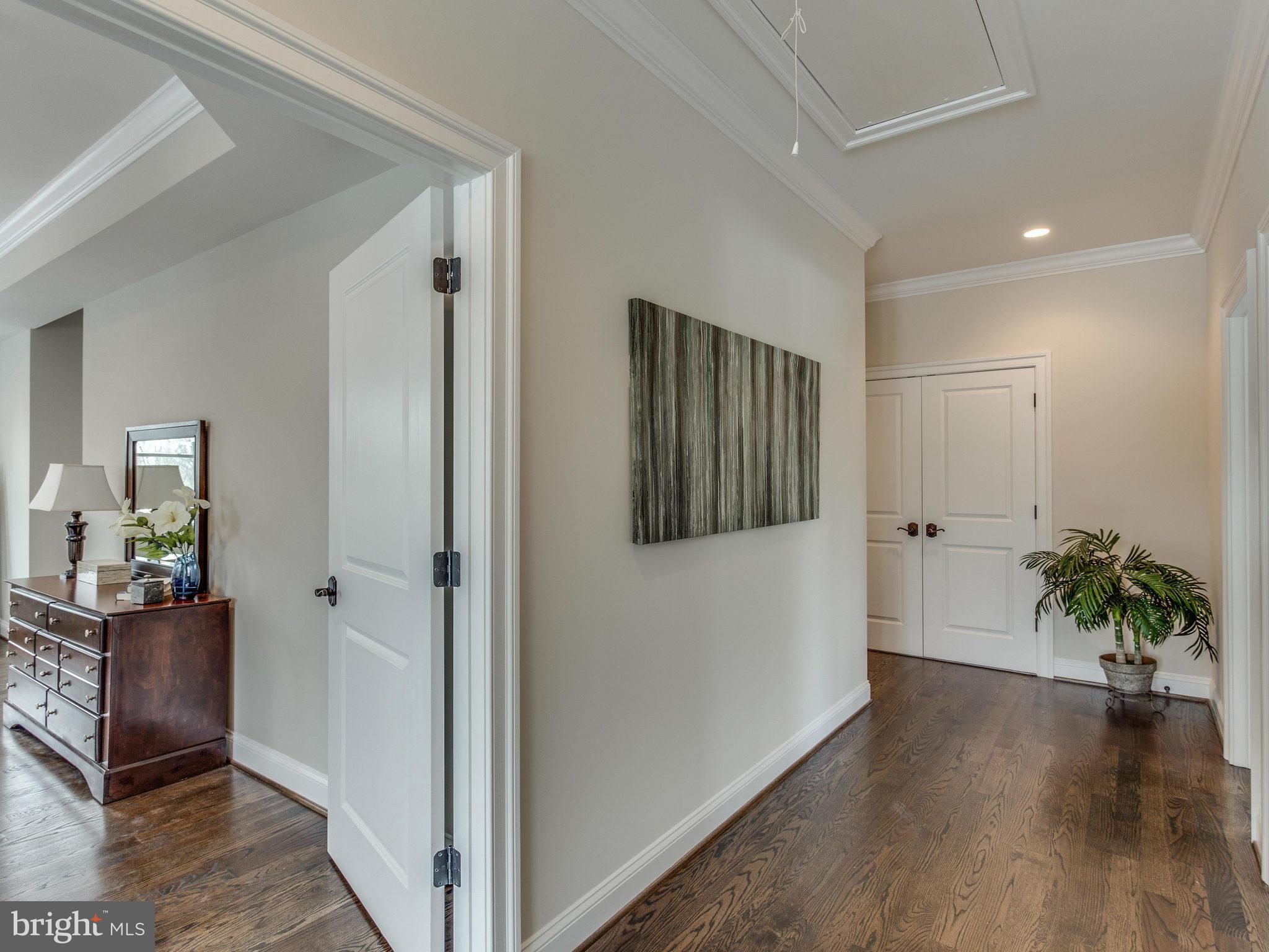 3100 North Rochester Street Arlington, VA 22213 - Photo 18 of 30 a view of a hallway with wooden floor and a livingroom